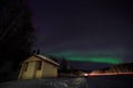 House, cabin, Aurora, night at alaska, fairbanks Royalty Free Stock Photo