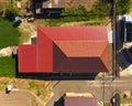 A house with a canopy over the courtyard. Roof from corrugated metal profile. Metal tiles. Royalty Free Stock Photo