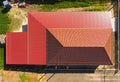 A house with a canopy over the courtyard. Roof from corrugated metal profile. Metal tiles. Royalty Free Stock Photo