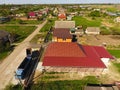 A house with a canopy over the courtyard. Roof from corrugated metal profile. Metal tiles. Royalty Free Stock Photo