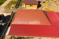 A house with a canopy over the courtyard. Roof from corrugated metal profile. Royalty Free Stock Photo