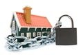 House in chains locked with padlock Royalty Free Stock Photo
