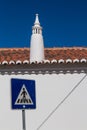 House with a chimney and a traffic sign Royalty Free Stock Photo