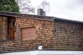 House clad with wood shingles and closed shutters Royalty Free Stock Photo