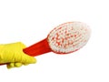 House Cleaning. Female hand in yellow glove cleaning window with multicolored rag.Hand in yellow glove with sponge . Royalty Free Stock Photo