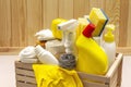 House cleaning product in wooden box. Spray, bottle, gloves, dishwashing sponge, scraper, gel air freshener. Stone concrete