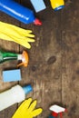 House cleaning products variety on wooden surface, overhead view. From above, flat lay. Space for text Royalty Free Stock Photo