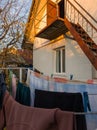 A house with clothes hanging out to dry on a clothes line Royalty Free Stock Photo