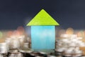 House on a coin pile, real estate investment, save money with a coin pile