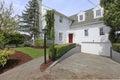 House colonial white with red door exterior front. Royalty Free Stock Photo