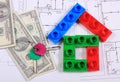 House of colorful building blocks, keys and banknotes on drawing Royalty Free Stock Photo