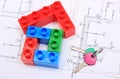 House of colorful building blocks, keys on drawing of home
