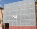 house completely covered with scaffolding and the protective net Royalty Free Stock Photo