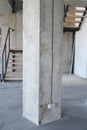 House concrete column with wire and outlet plug Royalty Free Stock Photo