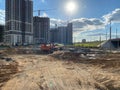 House construction with construction cranes on a background of blue sky. Construction and repair. Industry. Building sector.