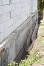 House construction without foundation bitumen waterproofing. Building construction errors.