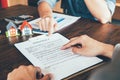 House Contract, Man reading a contract to purchase a home with a Royalty Free Stock Photo