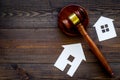 House cutout near judge gavel on dark wooden background top view copy space. Housing law. Property division. Real estate Royalty Free Stock Photo