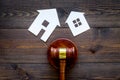 House cutout near judge gavel on dark wooden background top view copy space. Housing law. Property division. Real estate Royalty Free Stock Photo