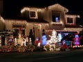 Illuminated Holiday Cheer: Rancho Cucamonga House Decorated with Christmas Lights at Night. Royalty Free Stock Photo