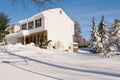 House in deep winter snow