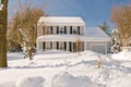 House in deep winter snow