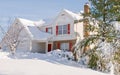 House in deep winter snow