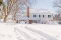 House in deep winter snow