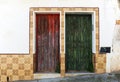 House of popular architecture with two wooden doors in a humble neighborhood of a Spanish town Royalty Free Stock Photo