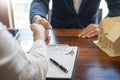 House developers agent or financial advisor and customers shaking hands after signing document making deal as successful Royalty Free Stock Photo