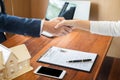 House developers agent or financial advisor and customers shaking hands after signing document making deal as successful Royalty Free Stock Photo