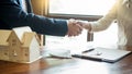 House developers agent or financial advisor and customers shaking hands after signing document making deal as successful Royalty Free Stock Photo