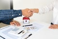 House developers and customer shaking hand after accept agreement finish buying or rental real estate for transfer right of Royalty Free Stock Photo