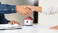 House developers and customer shaking hand after accept agreement finish buying or rental real estate for transfer right of Royalty Free Stock Photo