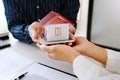 House developers and customer shaking hand after accept agreement finish buying or rental real estate for transfer right of Royalty Free Stock Photo