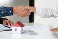 House developers and customer shaking hand after accept agreement finish buying or rental real estate for transfer right of Royalty Free Stock Photo