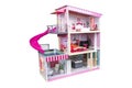 House of dolls with furniture isolated on white background. Furnished pink doll house isolated. Dollhouse. House construction with