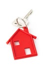House door key with red house key chain pendant Royalty Free Stock Photo