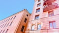 House dwelling building against blue sky with red color toning. Urban landscape. Soft focus. film grain pixel texture