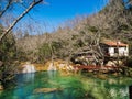 House on the edge of a river in the mountains Royalty Free Stock Photo