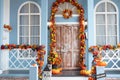 House entrance staircase decorated for autumn holidays, fall flowers and pumpkins Royalty Free Stock Photo