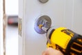 house exterior door with the inside internal parts of the lock visible of a professional locksmith installing or repairing a new d Royalty Free Stock Photo