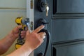 house exterior door with the inside internal parts of the lock visible of a professional locksmith installing or repairing a new d Royalty Free Stock Photo