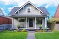 House exterior. Entrance porch and front yard view Royalty Free Stock Photo