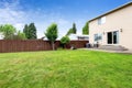 House exterior with walkout patio and spacious backyard area