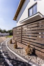 House exterior with wooden arbour