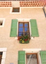 French mint green vintage window with a pot of colorful flowers and nude wall then red brick. Fits to quotes background