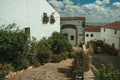 House facade with white walls, stairs, flower pots and plants at Caceres Royalty Free Stock Photo