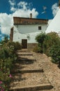 House facade with white walls, stairs, flower pots and plants at Caceres Royalty Free Stock Photo