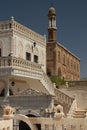 House facades and an Assyrian church in the historical part of the city of Midyat, Turkey